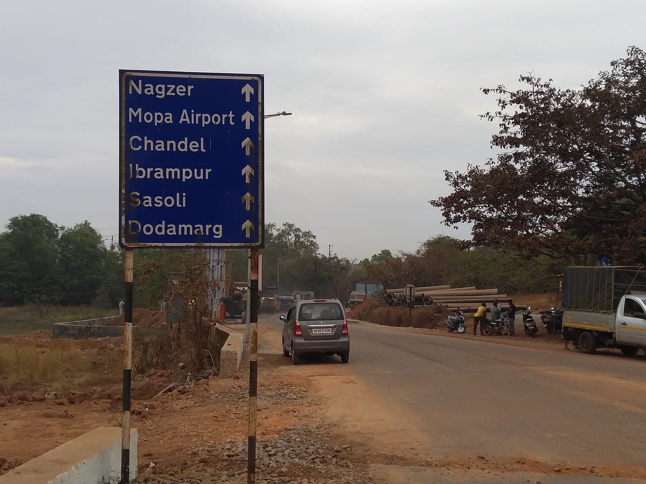 Road sign pointing to Mopa Airport in Pernem, North Goa