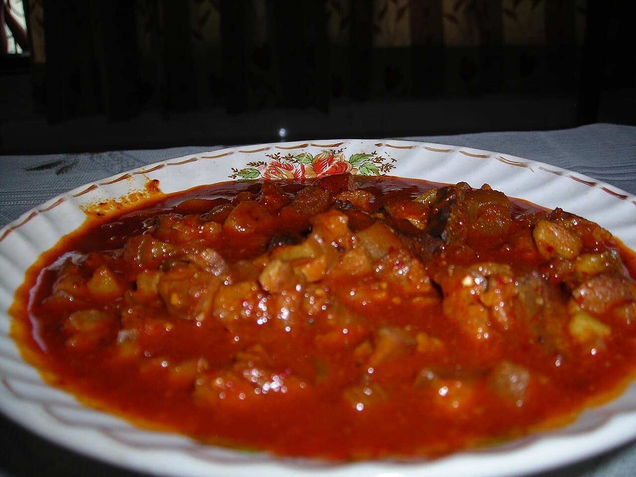 Plate of Goan pork sorpotel in a rich red gravy