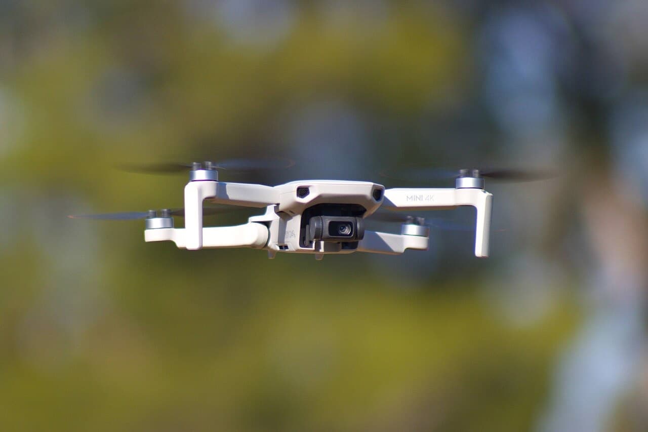 DJI Mini 4K drone hovering in flight