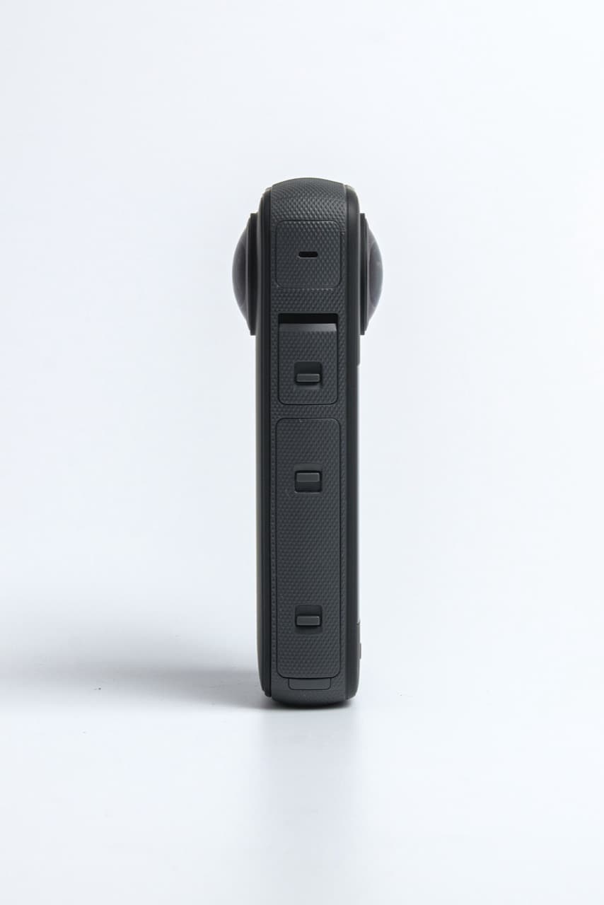 Insta360 X3, side profile with buttons and port covers