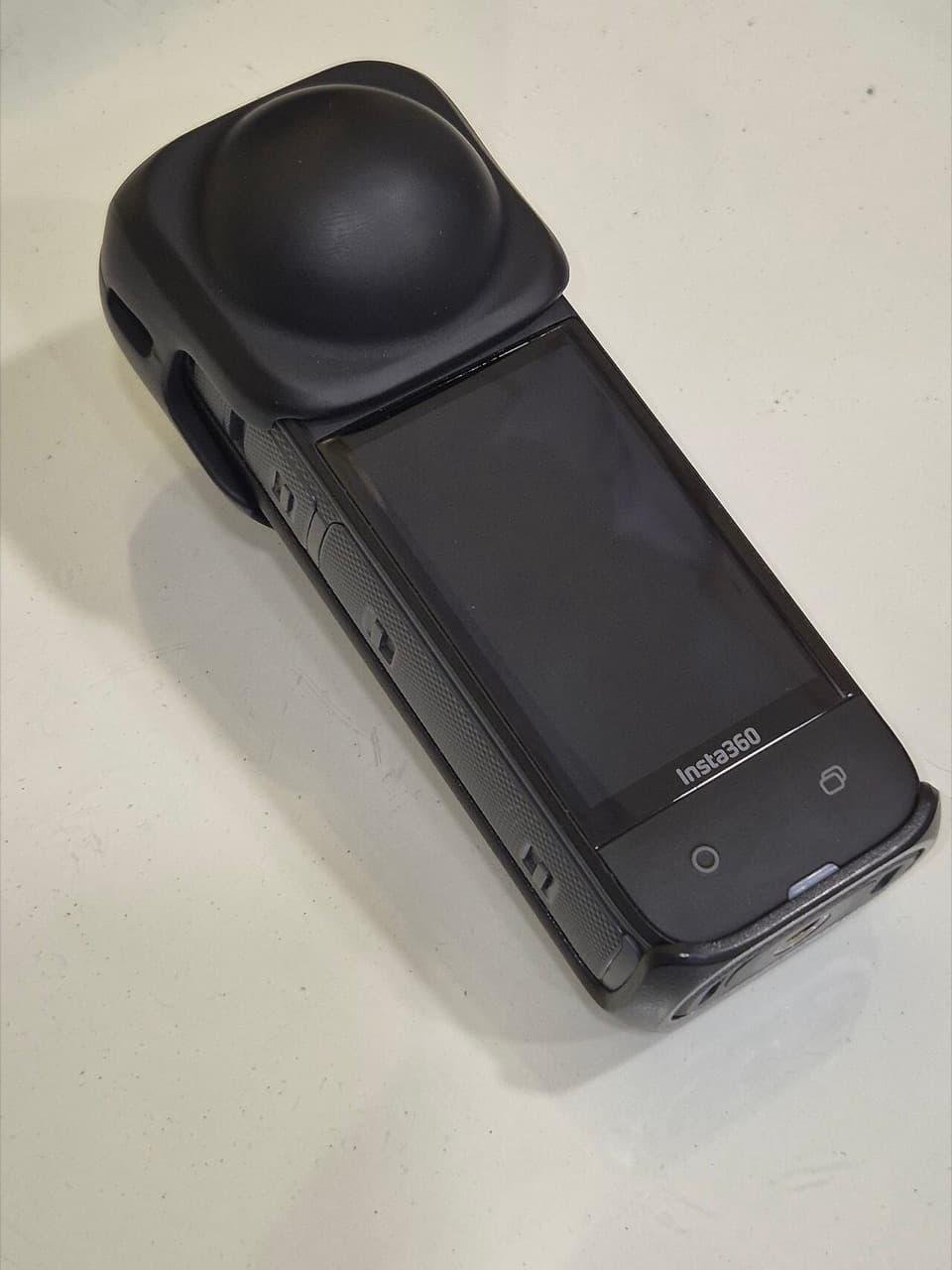 Insta360 X4 with protective lens cap fitted