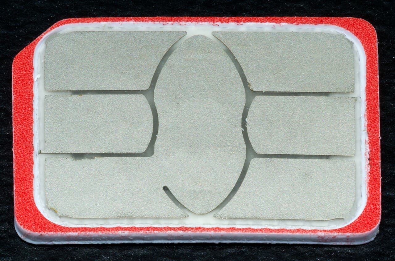 Close-up of a nano SIM card showing its gold contact chip